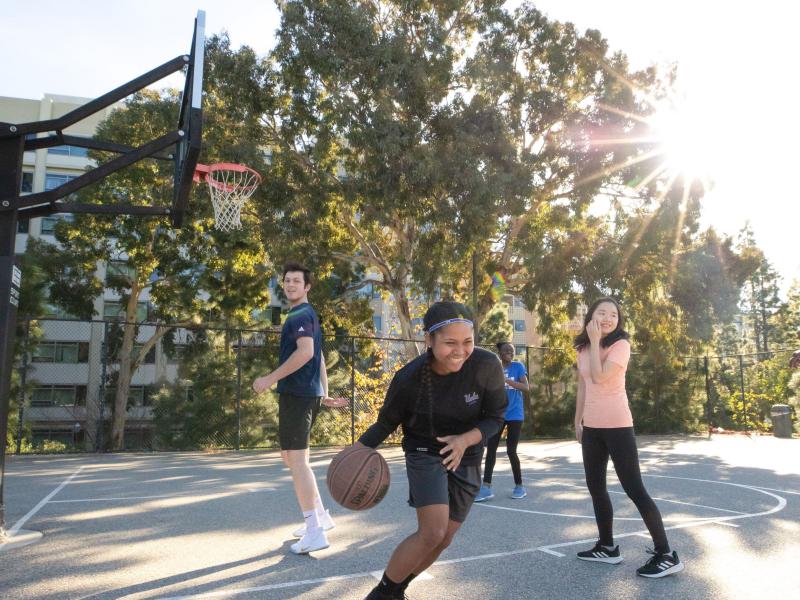 Students playing basketball